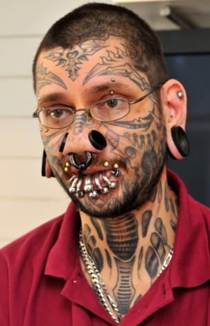 would want to cover your entire face with a face tattoo is beyond me.